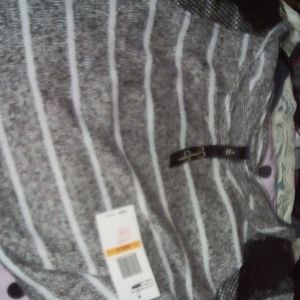 Small grey white and black sweater style shirt